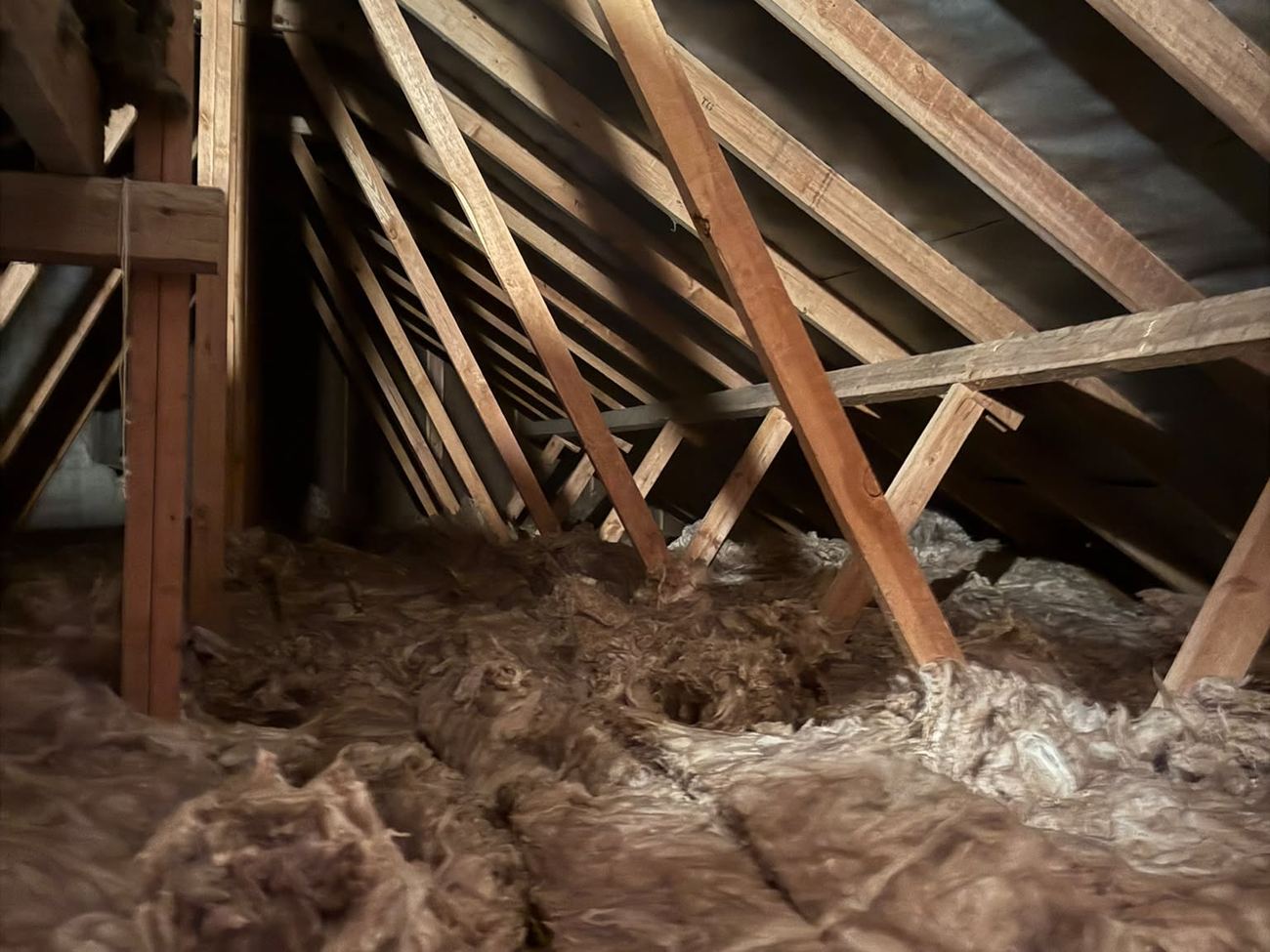 Consistent mineral wool coverage across the bungalow loft after the 120m² top-up in Winchester